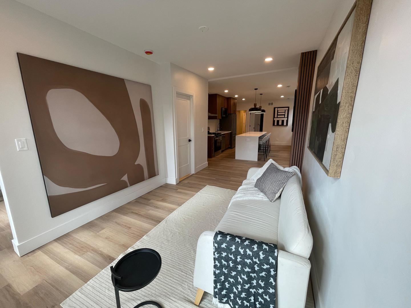 1310 West Erie Street, Unit 2 Chicago, IL 60642 - Photo 4 of 12 a living room with furniture and a fireplace