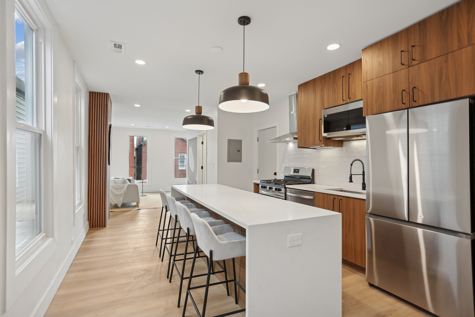 1310 West Erie Street, Unit 2 Chicago, IL 60642 - Photo 7 of 12 a kitchen with stainless steel appliances a stove refrigerator sink and microwave