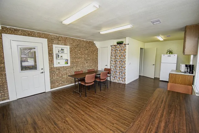 a view of a livingroom with furniture and wooden floor