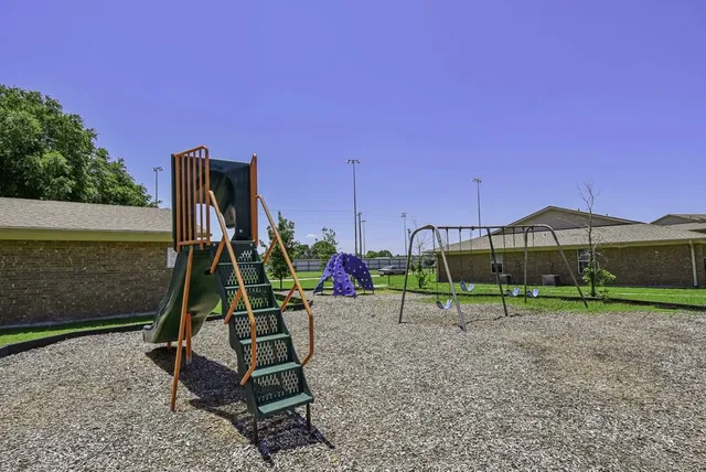 a view of a park with a slide