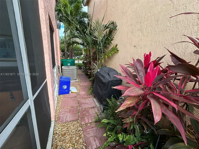 a front view of house with yard and swimming pool