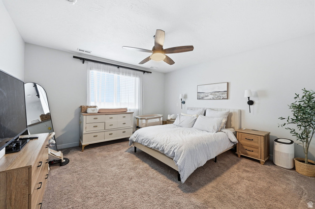 1175 Silver Hollow Road Syracuse, UT 84075 - Photo 18 of 34 Carpeted room featuring a ceiling fan with integrated lighting, a window with blinds and sheer curtains, and light-toned walls