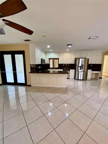a view of a entryway with kitchen