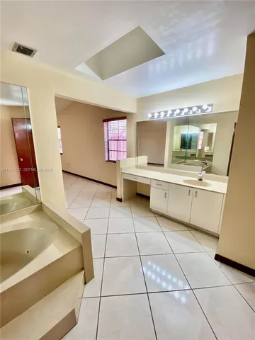 a view of a livingroom with an empty space and a sink