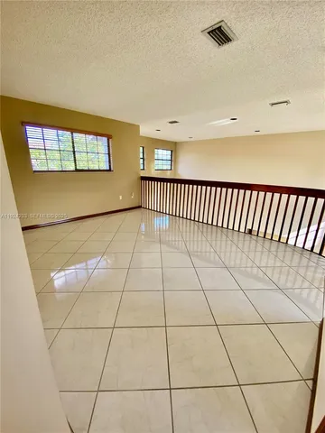 a view of a backyard with swimming pool