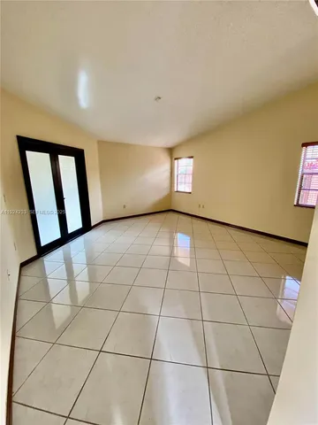 a view of a refrigerator in kitchen and wooden floor