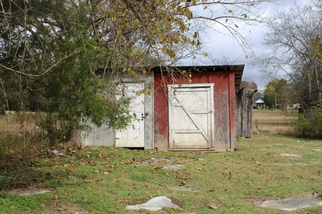 a view of a barn with a yard