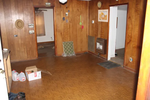 a room with a workspace and a window