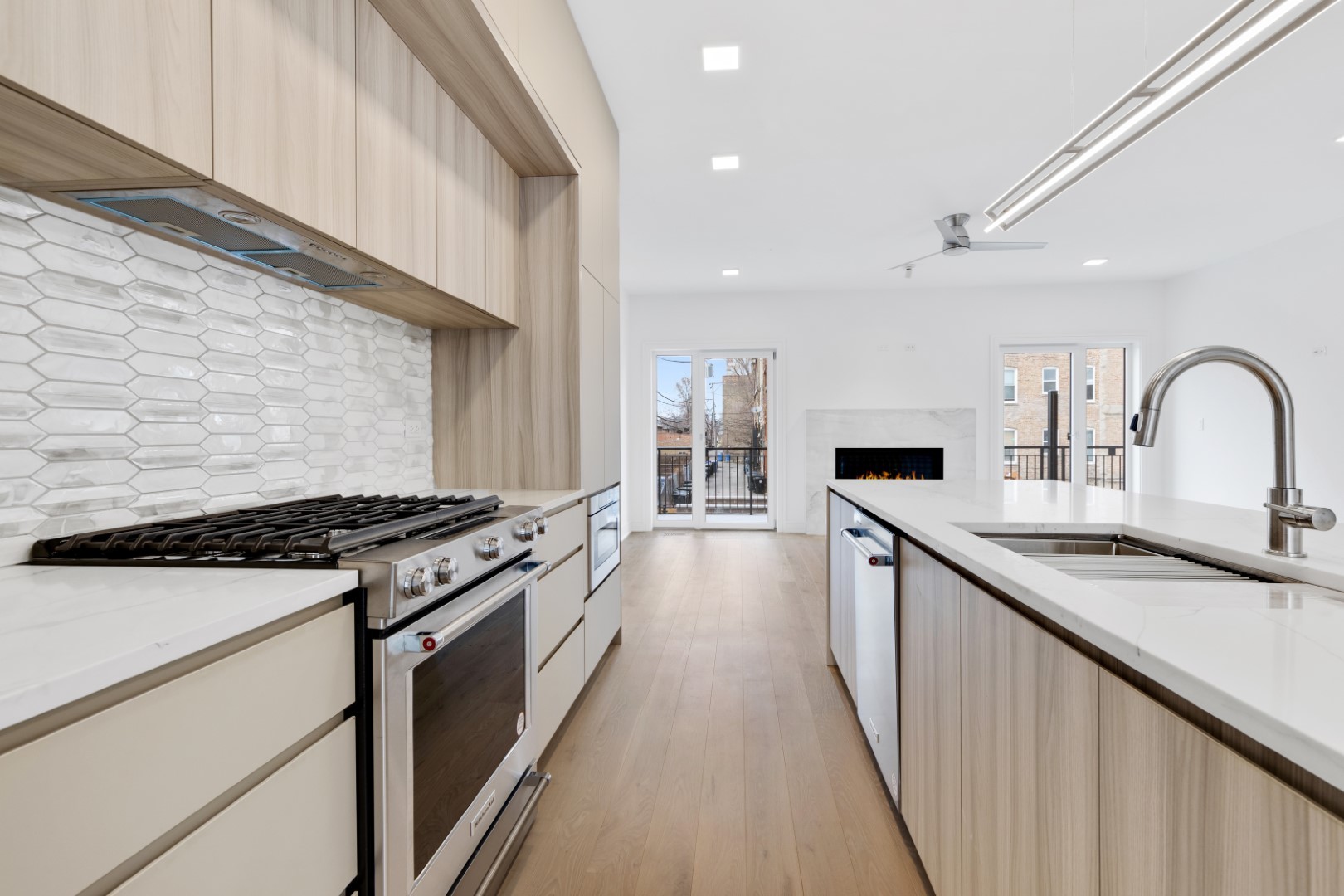 334 East Pershing Road Chicago, IL 60653 - Photo 11 of 86 a kitchen with stainless steel appliances granite countertop a sink stove and cabinets