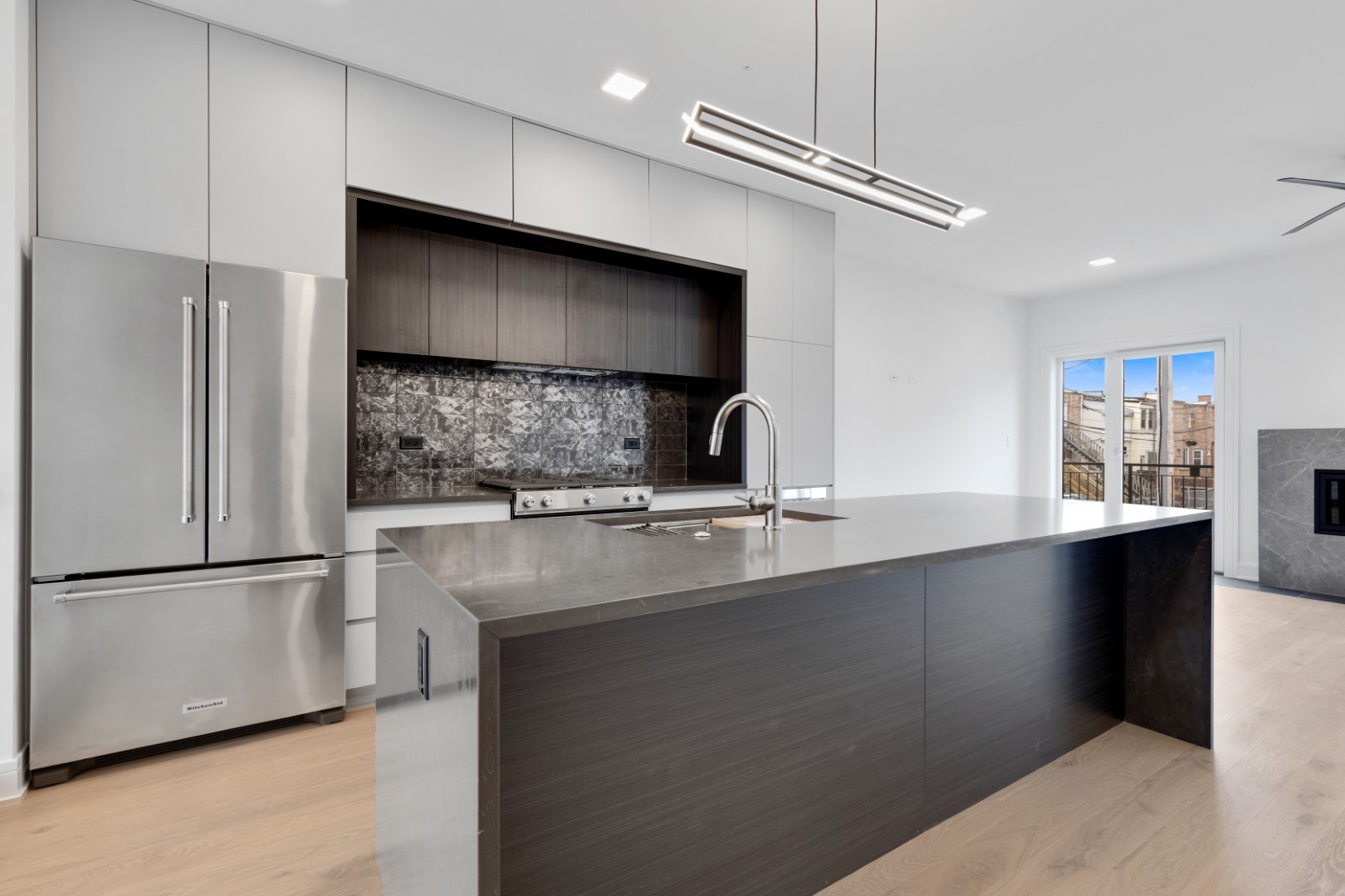 334 East Pershing Road Chicago, IL 60653 - Photo 20 of 86 a kitchen with stainless steel appliances a sink and a refrigerator