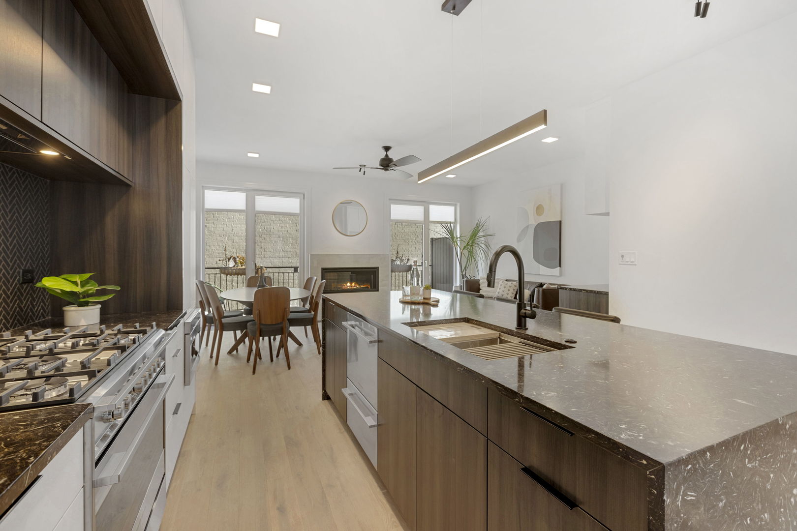 334 East Pershing Road Chicago, IL 60653 - Photo 23 of 86 a kitchen with stainless steel appliances granite countertop a sink a stove and a refrigerator