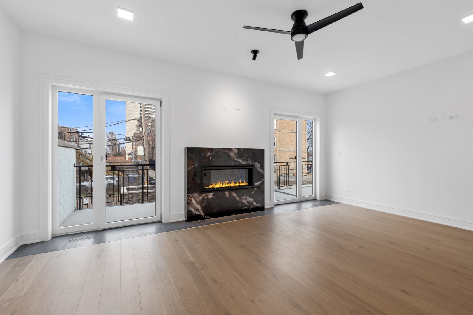 334 East Pershing Road Chicago, IL 60653 - Photo 29 of 86 a view of a livingroom with furniture hardwood floor and a ceiling fan