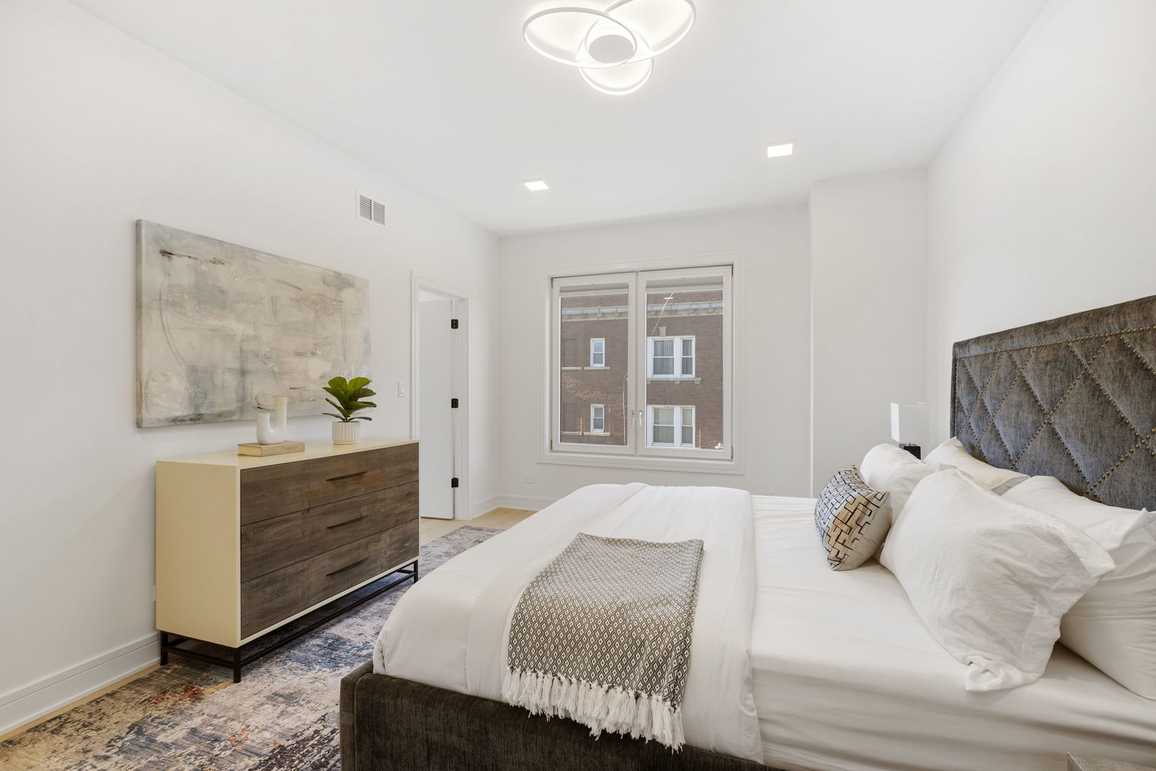 334 East Pershing Road Chicago, IL 60653 - Photo 38 of 86 a bedroom with a bed and a dresser