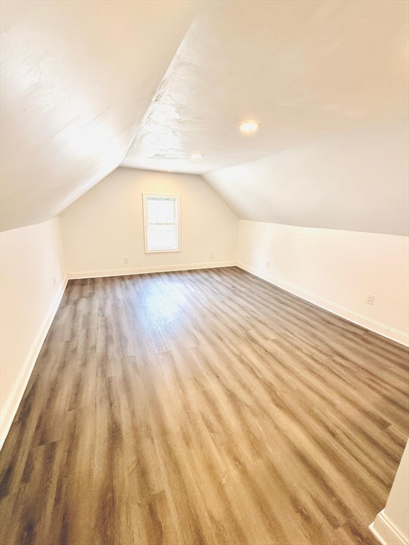 154 Marshall Street, Unit 2 Fitchburg, MA 01420 - Photo 8 of 9 a view of wooden floor and brick wall