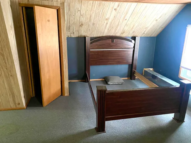 a room with a table and dresser