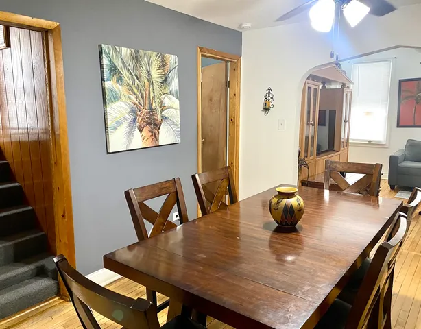 a view of a dining room with furniture and wooden floor