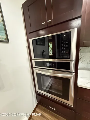 a view of a room with wooden furniture
