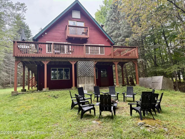 a view of a chairs and table in patio