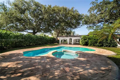 a view of pool with umbrella