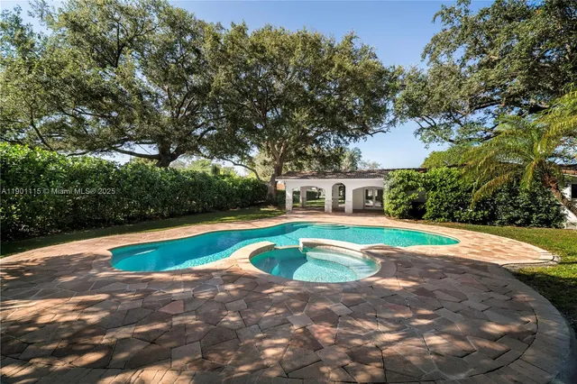 a view of pool with umbrella