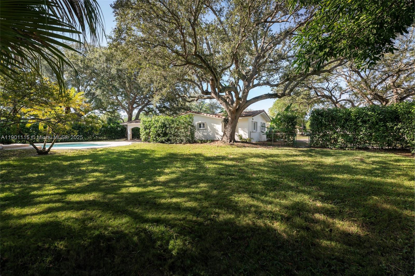 8390 Southwest 132nd Street Pinecrest, FL 33156 - Photo 8 of 12 a view of a green field