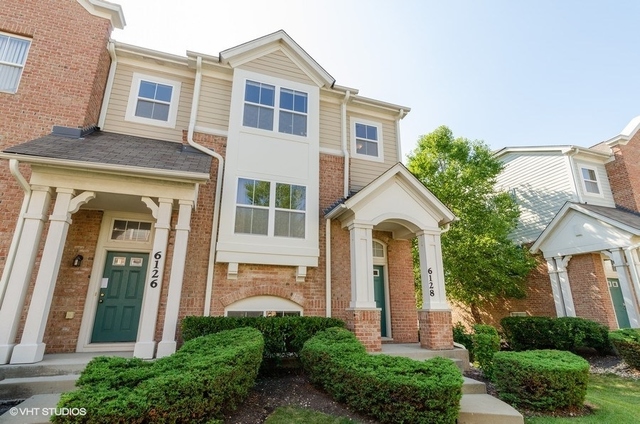 front view of a house with a garden