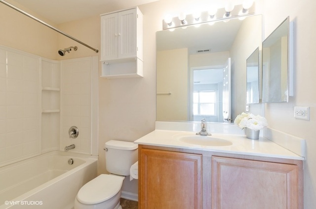 6128 Washington Court Morton Grove, IL 60053 - Photo 6 of 11 a bathroom with a sink a toilet and shower