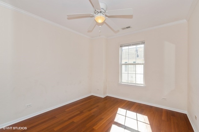 6128 Washington Court Morton Grove, IL 60053 - Photo 8 of 11 an empty room with wooden floor and a window