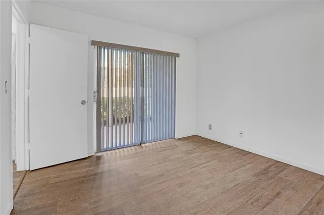 a bathroom with a sink a mirror a toilet and shower