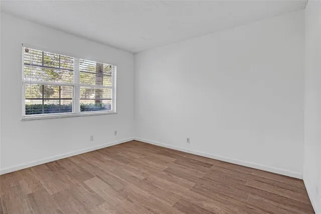 a kitchen with stainless steel appliances a refrigerator and microwave