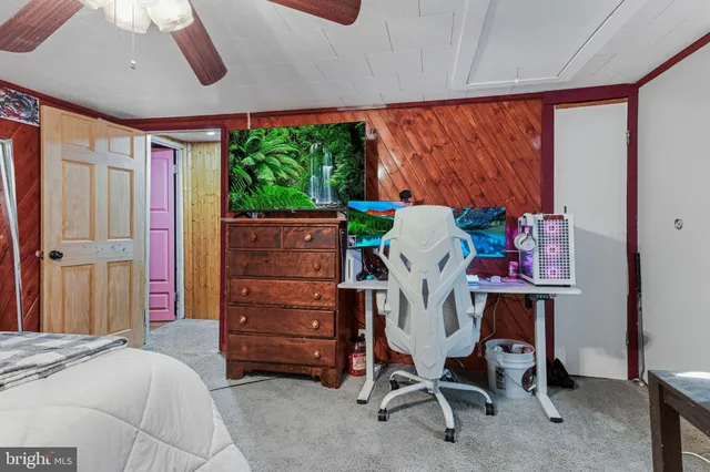 a bed room with a bed and a window