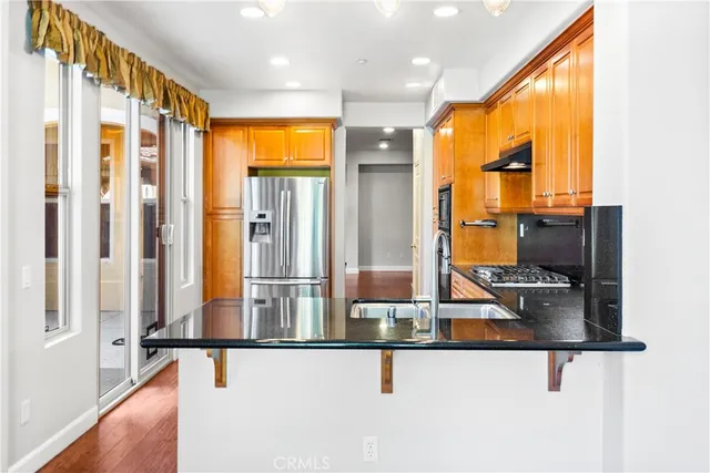 a kitchen with sink and furniture