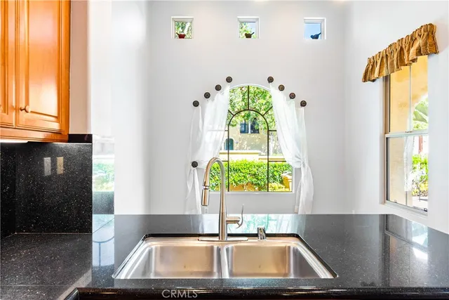 a kitchen with a sink and a window
