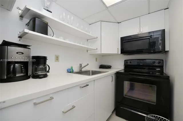a kitchen with a stove and a microwave