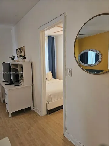 a bedroom with a bed and cabinets