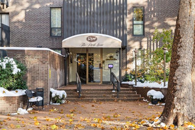 a backyard of a house with barbeque oven table and chairs