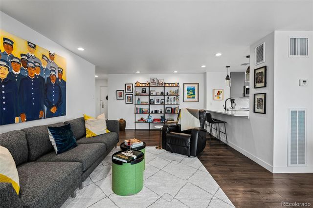 a living room with furniture and a rug