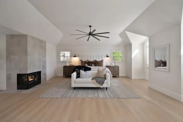 a living room with furniture fireplace and a flat screen tv
