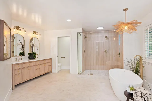 an aerial view of a house with swimming pool and garden