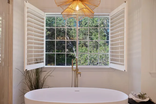 a view of a swimming pool with outdoor seating
