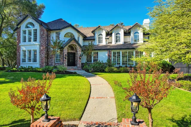 a front view of a house with swimming pool
