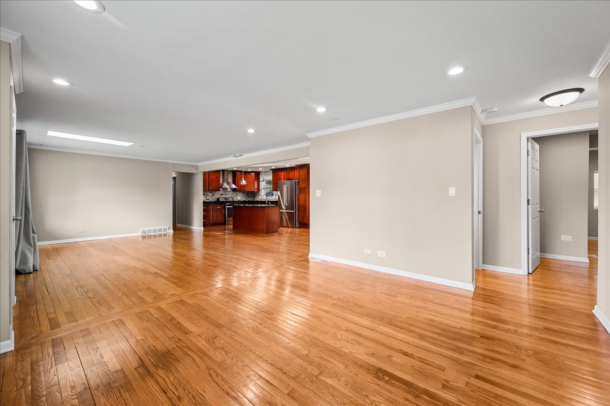 203 Coldren Drive Prospect Heights, IL 60070 - Photo 12 of 31 a view of empty room with wooden floor