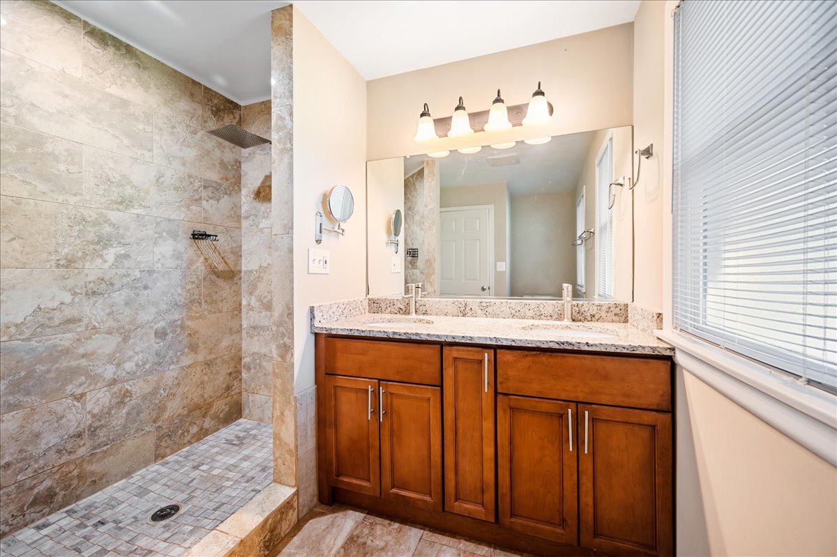203 Coldren Drive Prospect Heights, IL 60070 - Photo 18 of 31 a bathroom with a sink and a mirror