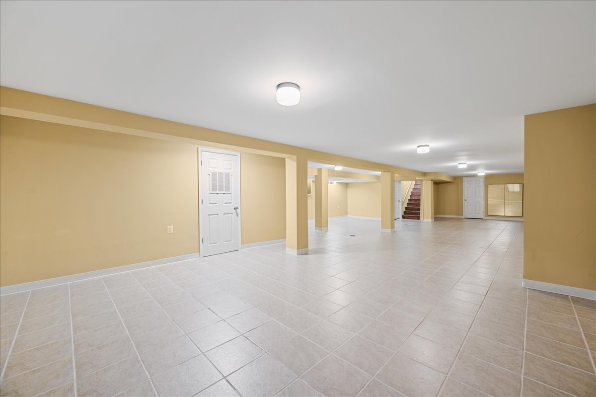 203 Coldren Drive Prospect Heights, IL 60070 - Photo 26 of 31 a view of an empty room with wooden floor