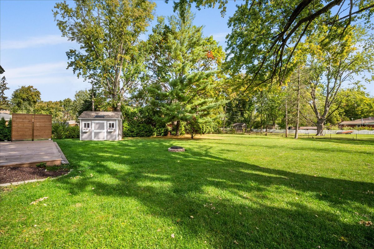 203 Coldren Drive Prospect Heights, IL 60070 - Photo 28 of 31 a view of a big house with a big yard and large trees