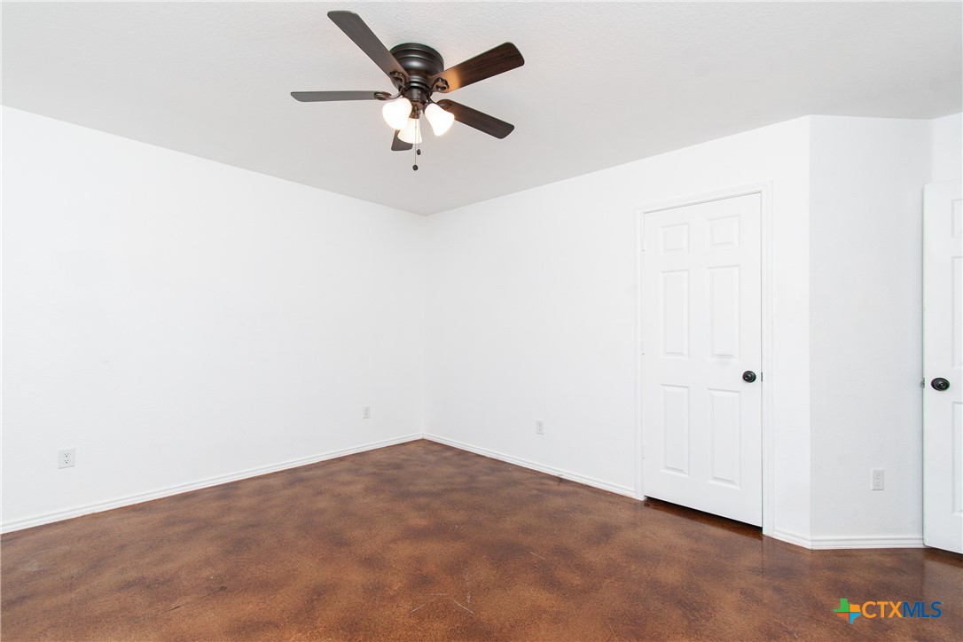 235 North Mary Jo Drive, Unit A Harker Heights, TX 76548 - Photo 7 of 16 an empty room with a window and a ceiling fan