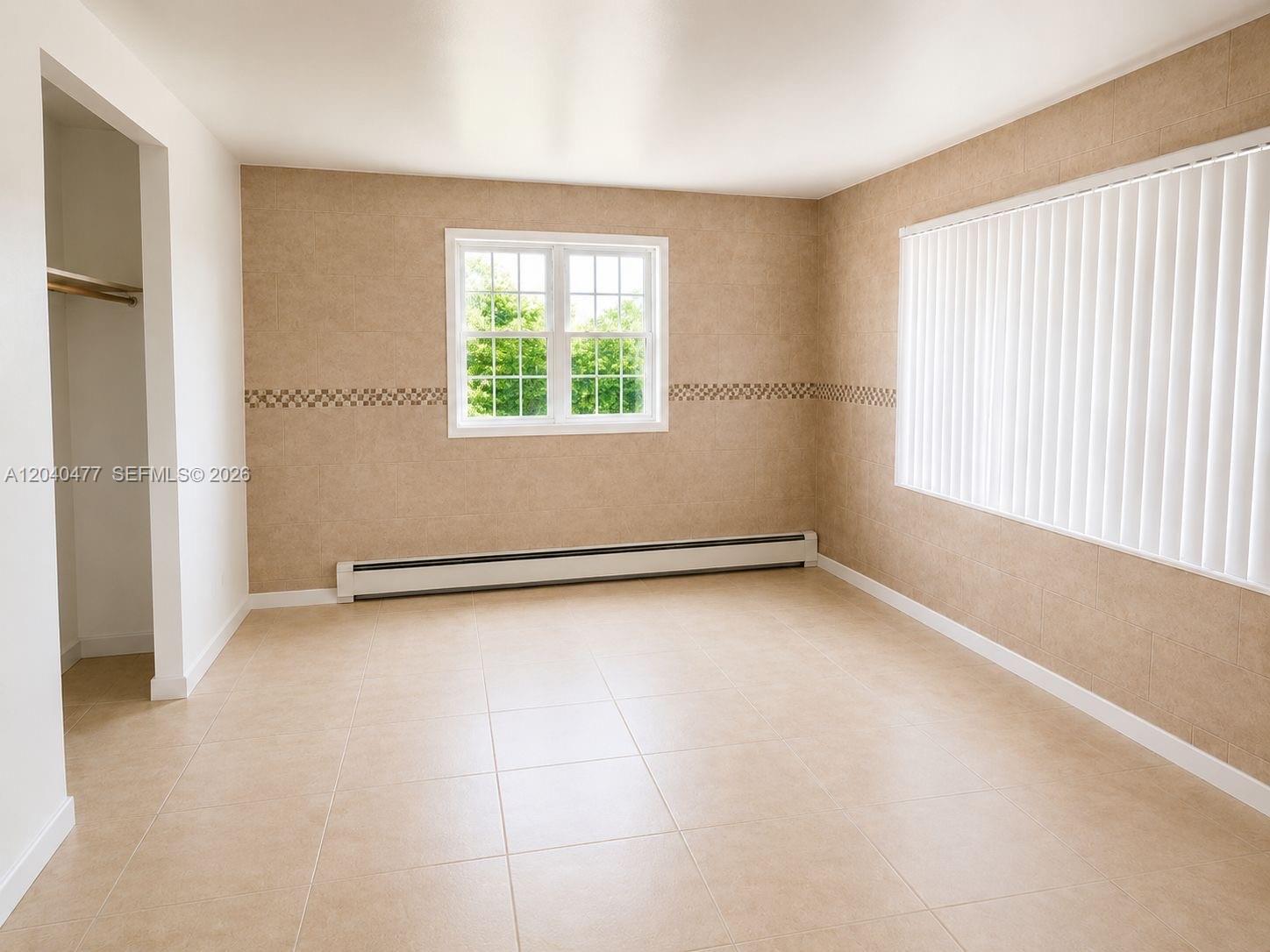 9110 Southwest 44th Street Miami, FL 33165 - Photo 14 of 18 an empty room with windows