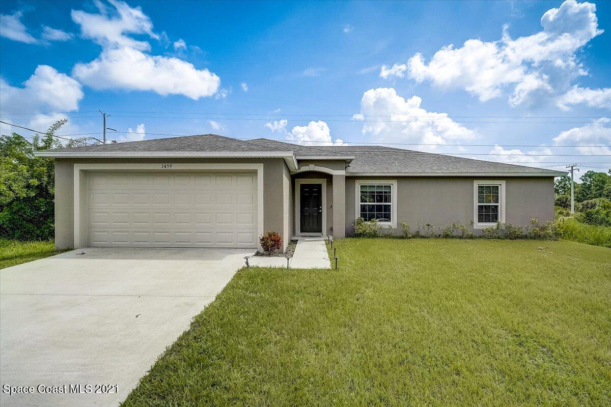 1459 Saxony Road Southwest Palm Bay, FL 32908 - Photo 1 of 38 front view of house with a yard
