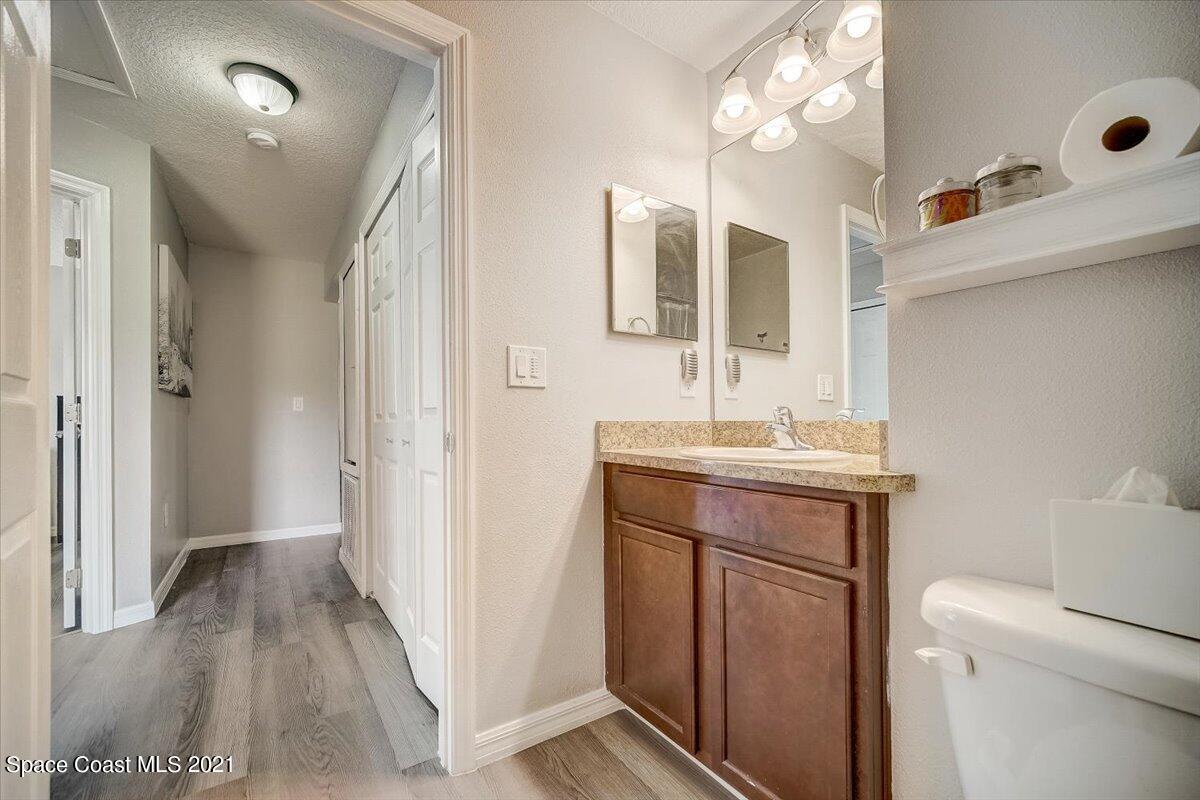 1459 Saxony Road Southwest Palm Bay, FL 32908 - Photo 20 of 38 a bathroom with a sink a toilet and shower