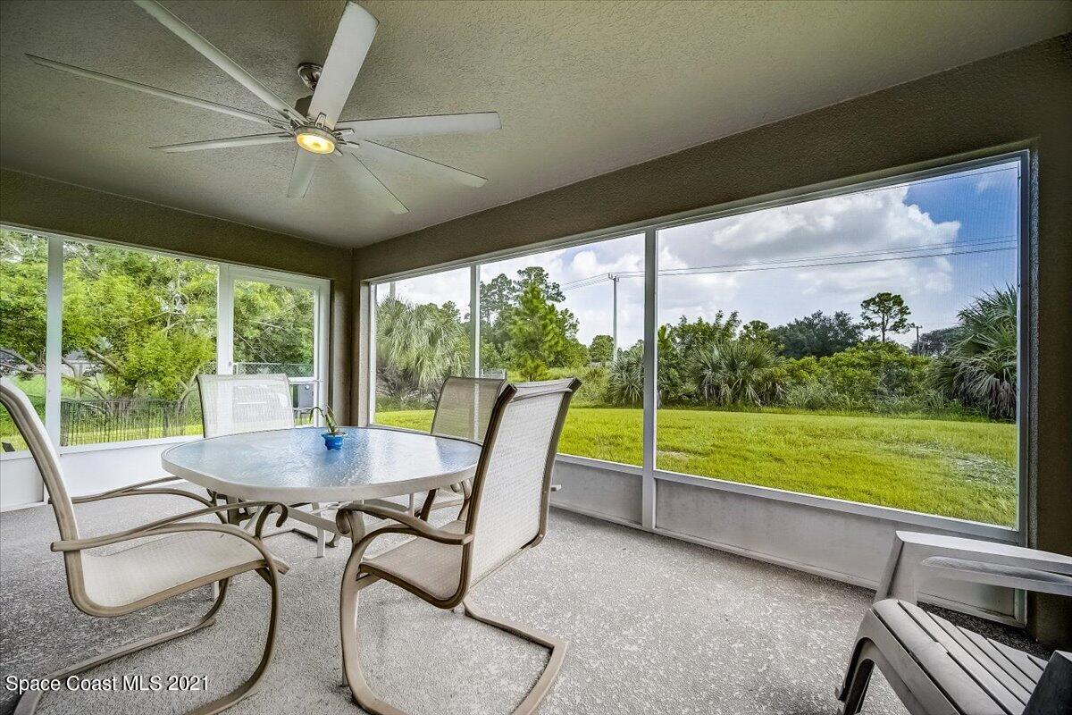 1459 Saxony Road Southwest Palm Bay, FL 32908 - Photo 33 of 38 a view of a dining room with furniture window and outside view